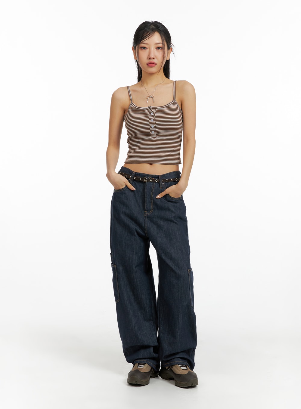 Pocketed Denim Wide Leg Jeans CF423 in dark blue, full-length front view on model, low-waist wide fit with eyelet belt, cargo pockets, paired with striped crop cami and chunky sneakers.