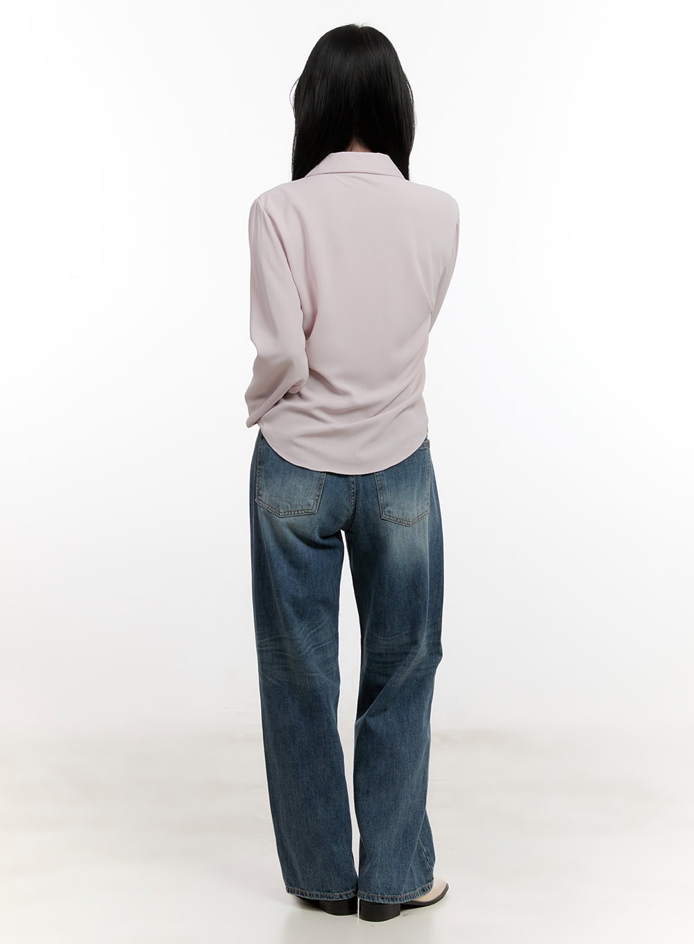 Belle Washed Wide-Leg Jeans CF528 in blue, back view on model, showing dual back patch pockets and washed denim texture, styled with pink shirt and cream boots.