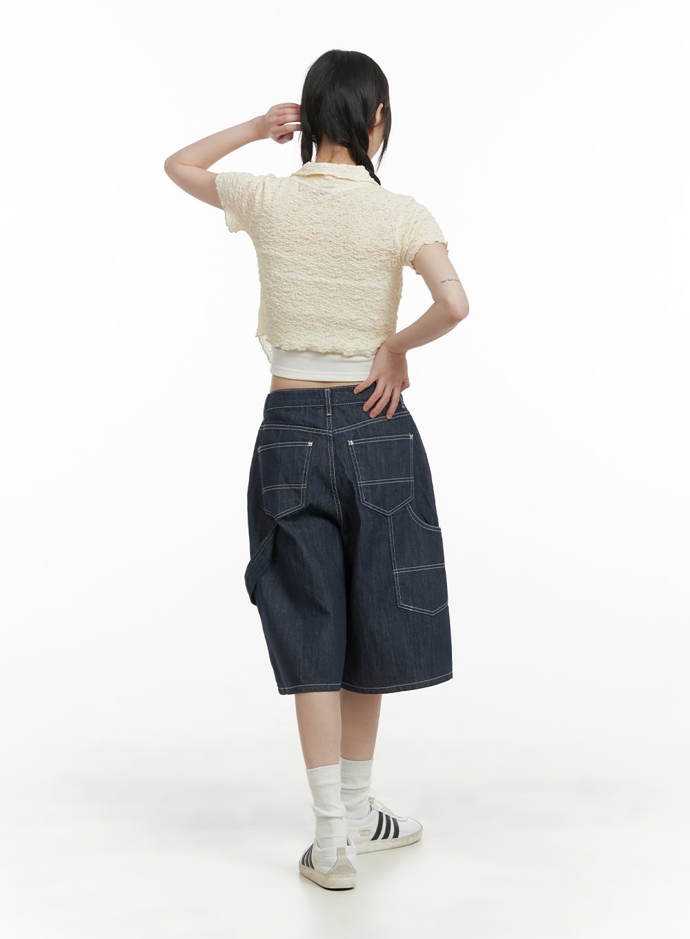Solid Wide-Leg Bermuda Jorts CY414 in dark blue, full-body back view on model, wide-fit midi denim showing back patch pockets and contrast topstitching, styled with cream crop top.