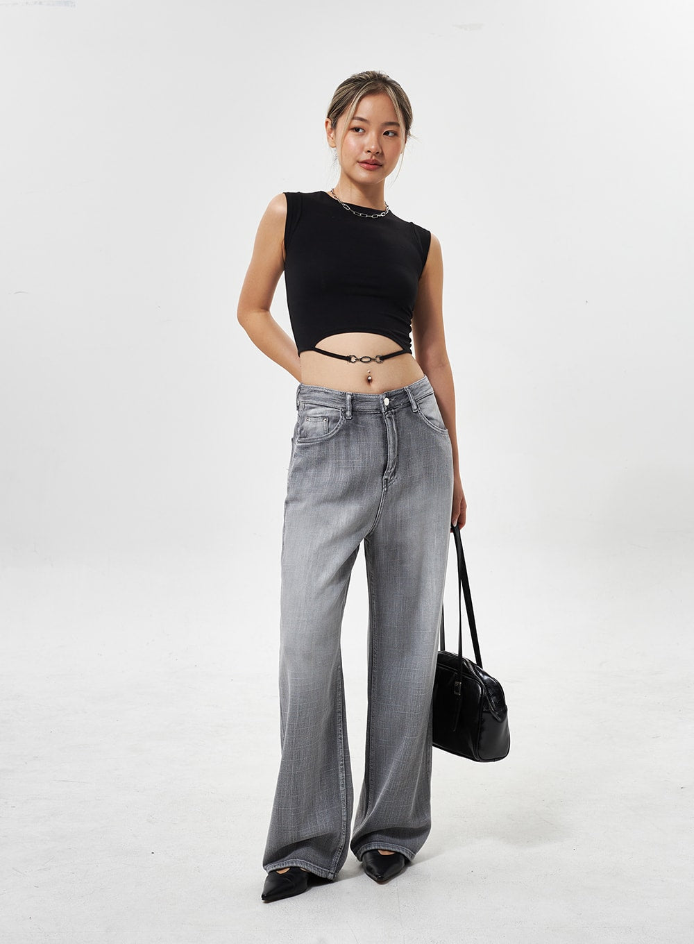 Mid-Rise Wide Leg Jeans CY330 in grey, full-length three-quarter front view on model, wide-leg washed cotton denim, paired with black crop top and bag.