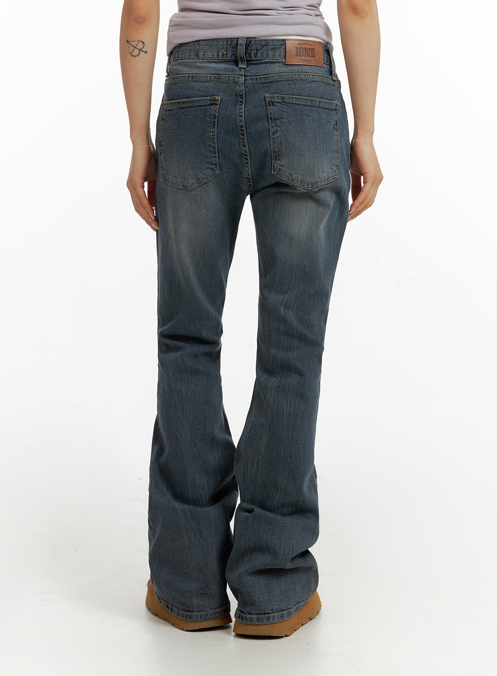 Slim Washed Flared Jeans CF416 in mid-blue, back view on model, five-pocket design with leather patch label, slim fit through thigh flaring to hem.