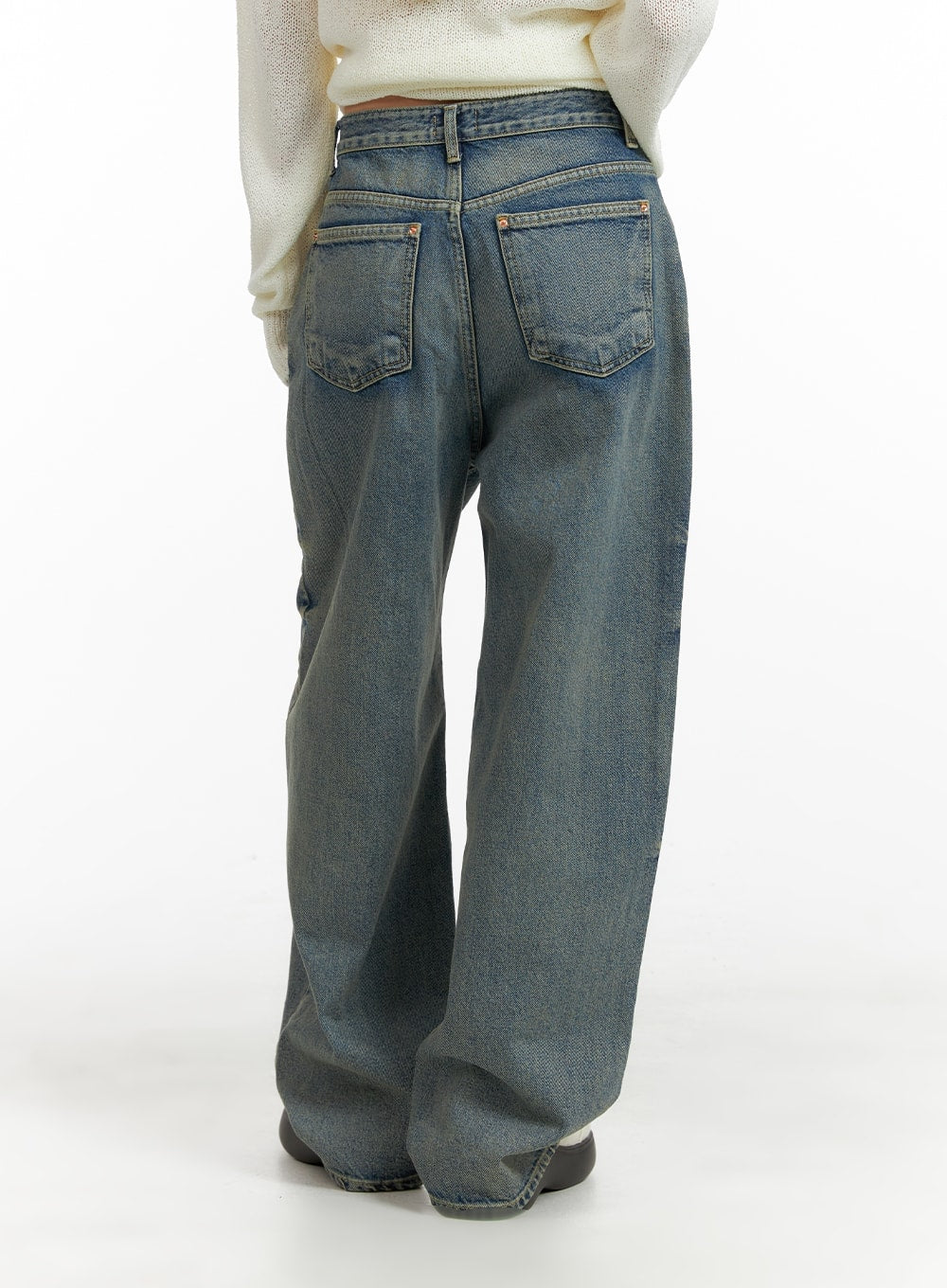 Urban Chic Washed Baggy Jeans CM411 in blue, back view on model, wide-fit washed denim with dual back pockets and relaxed wide leg, paired with cream knit sweater.