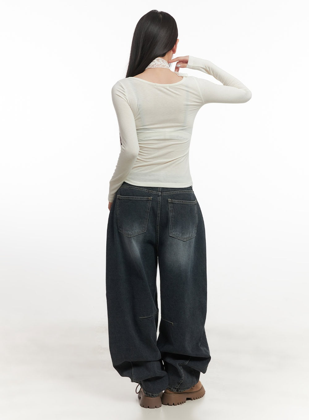Giselle Stitched Balloon-Fit Jeans CF526 in dark blue, back view on model highlighting two large patch pockets with contrast stitching and washed denim finish, styled with white long-sleeve.