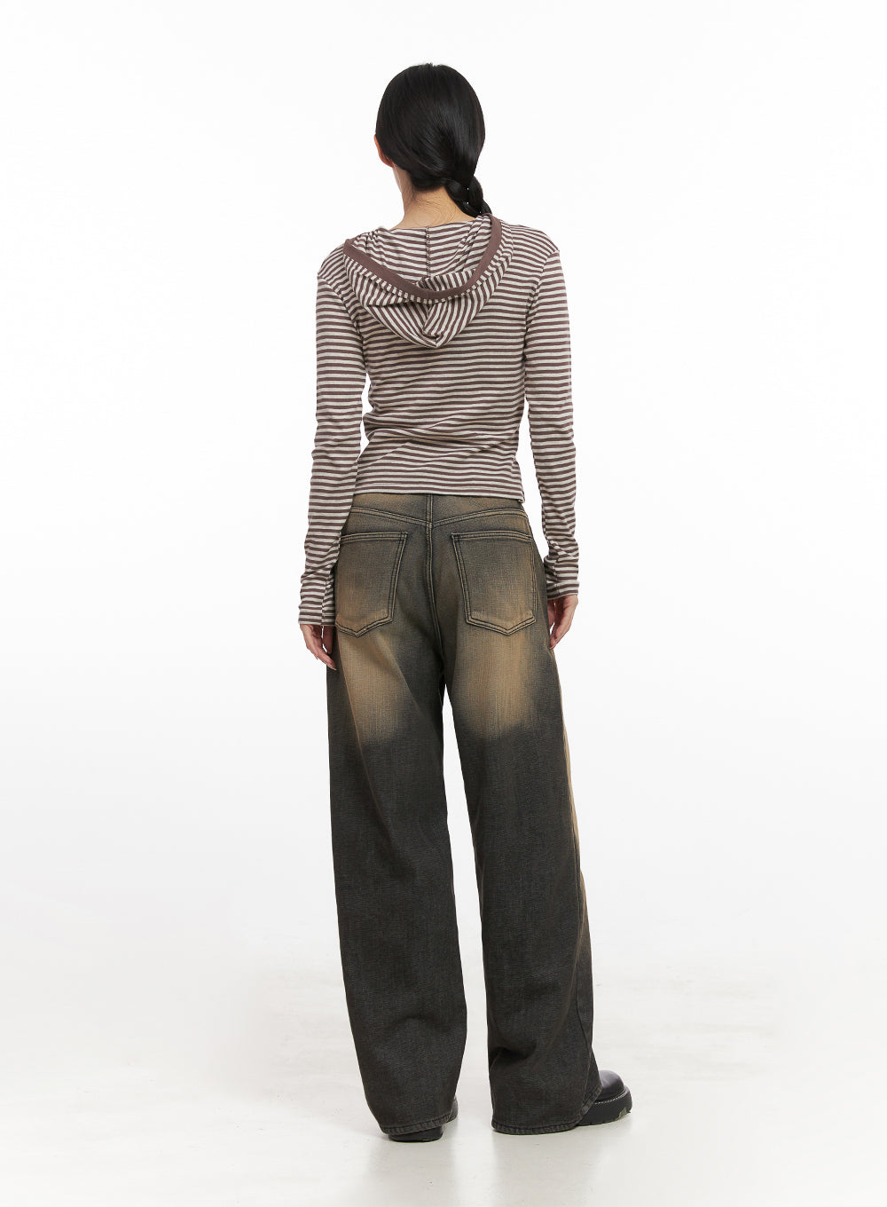 Alexa ComfyChic Washed Jeans CN428 in dark beige, full back view on model, wide-fit denim with dual back pockets and warm brown washed fade, paired with striped hoodie top and black platform loafers.