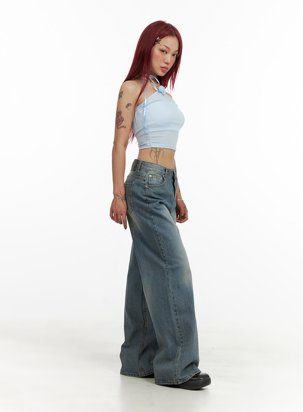 Wide Washed Denim Jeans CY429 in blue, side full-body shot on model looking over shoulder, wide-leg washed denim styled with light blue halter crop top, street-ready acubi look.