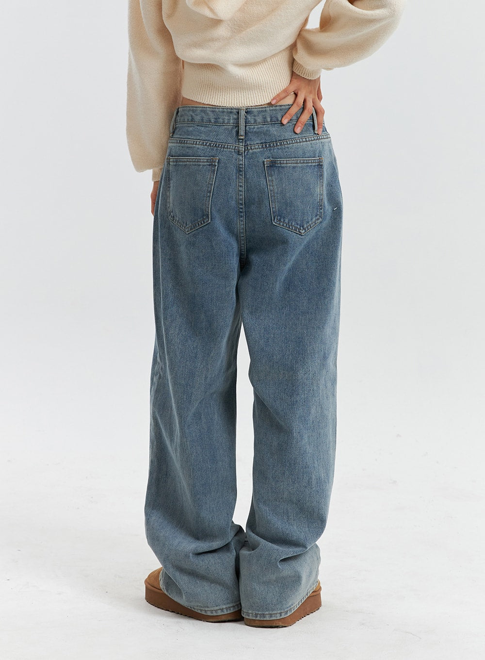 Mid Waist Washed Button Wide Leg Jeans OD320 in blue, back waist-to-hem view on model, dual patch back pockets with topstitching, washed cotton denim, wide-leg cut.
