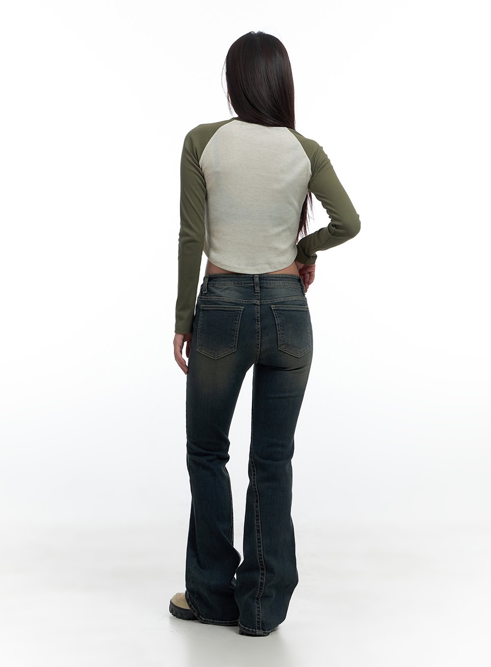 Aspen SlimFit Washed Bootcut Denim Jeans CS424 in dark blue, back full-body shot on model, dual back pockets with contrast stitching, bootcut flare, styled with a green raglan crop top.