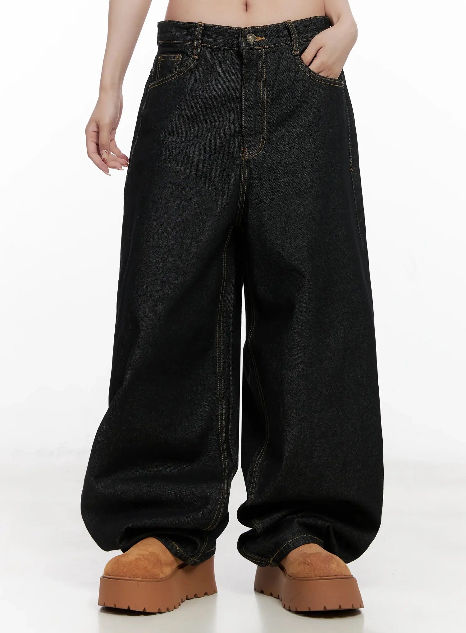 Halo Wide Leg Stitch Detail Jeans IN514 in black, closer front waist-down view on model, contrast gold stitching and front pockets visible, balloon-style hem bunching at tan platform shoes.