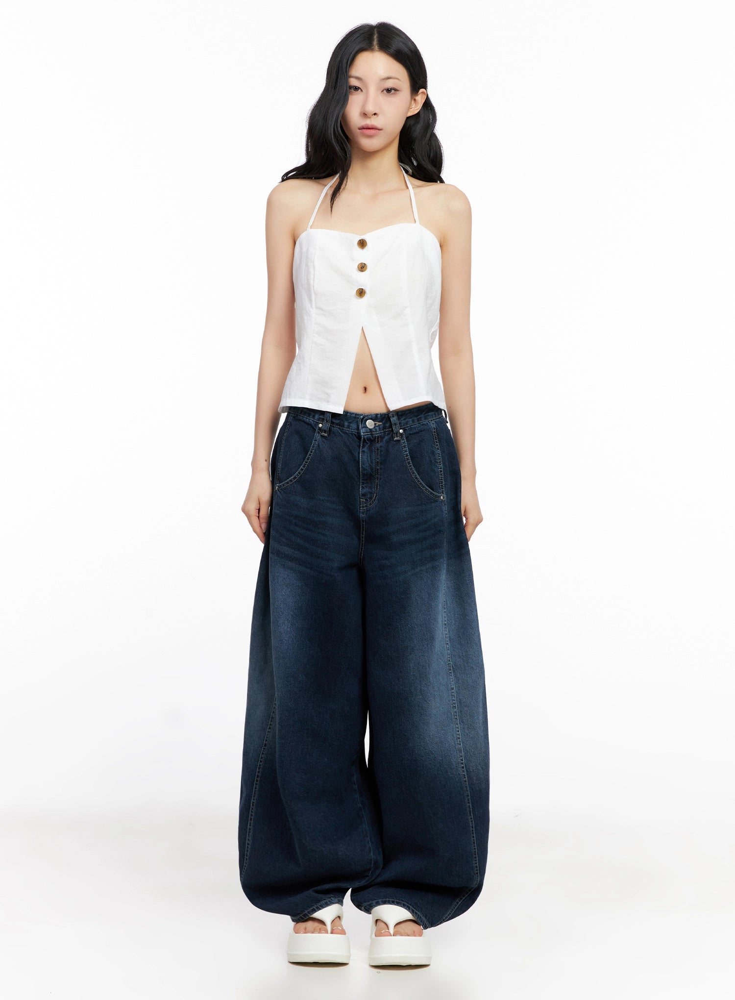 Sohee Angel Wing Print Wide-Leg Jeans IG508 in dark blue, full front view on model, voluminous wide-leg cotton denim with washed finish, paired with white halter crop top and white platform sandals.