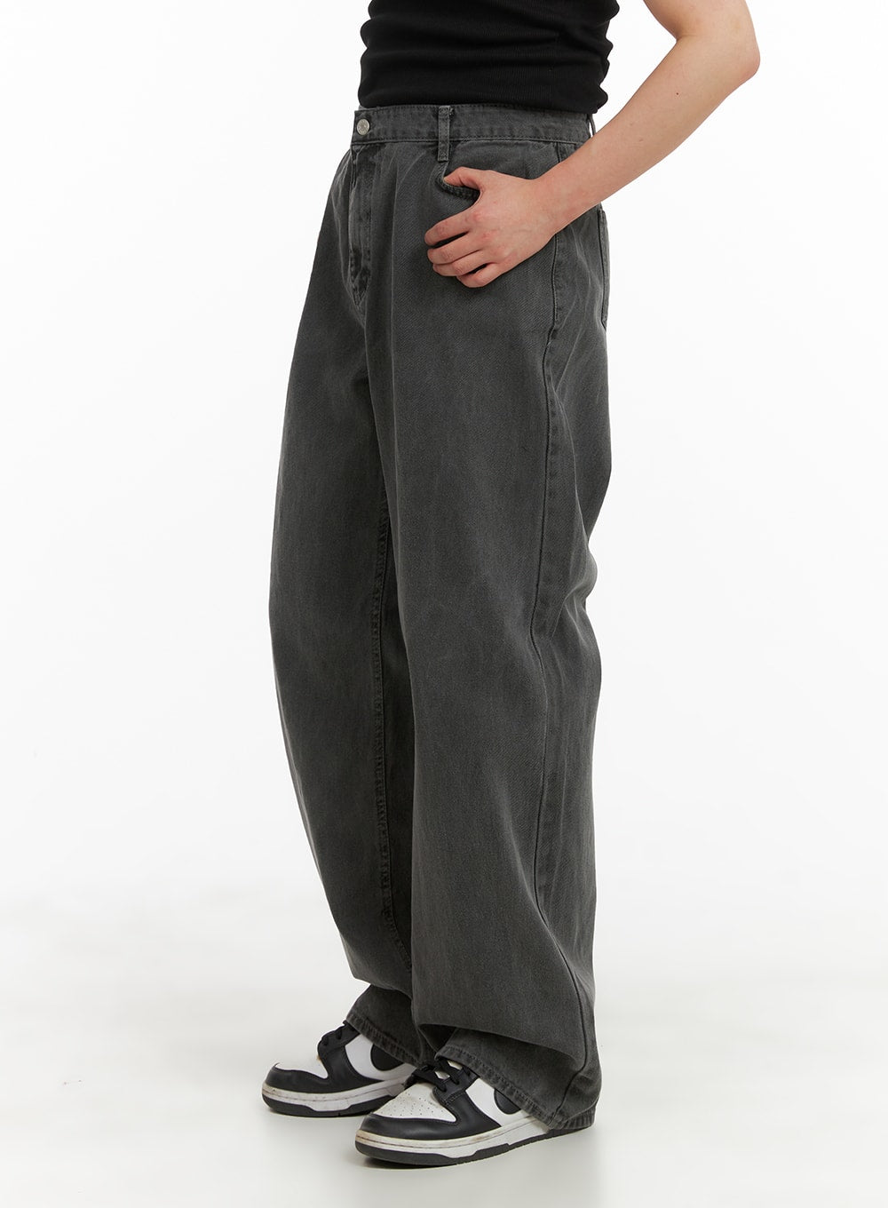 Men's Classic Baggy Fit Jeans IA401 in washed grey, side close-up on model, showing roomy baggy fit, side seam, and waistband detail, hand in pocket, sneakers visible.