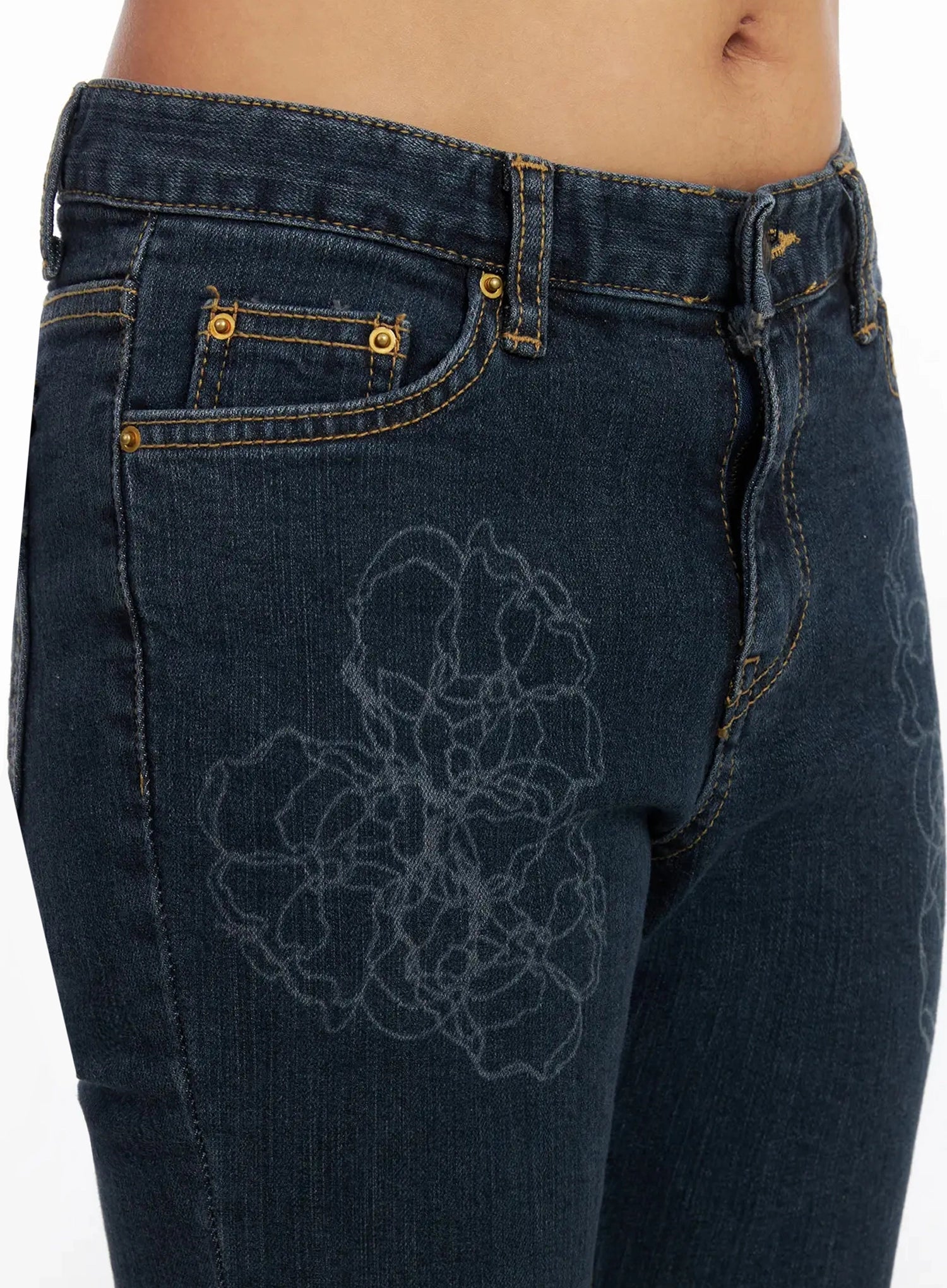 Amari Floral Embriodered Bootcut Jeans IN528 in dark blue, close-up detail of front hip area, showing floral outline embroidery, gold-rivet five-pocket construction, and contrast stitching on waistband.