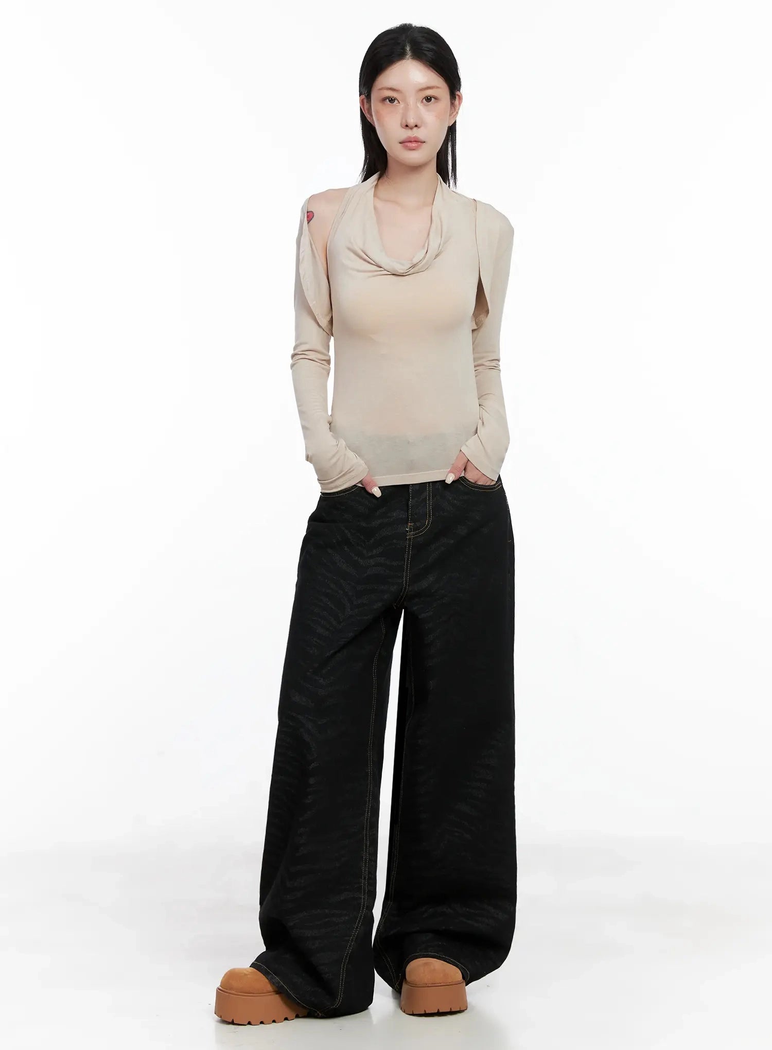Freyja Animal Print Wide Leg Jeans IS508 in black, full-length front view on model, wide-leg zebra-print cotton denim, paired with beige cowl-neck top and platform shoes.
