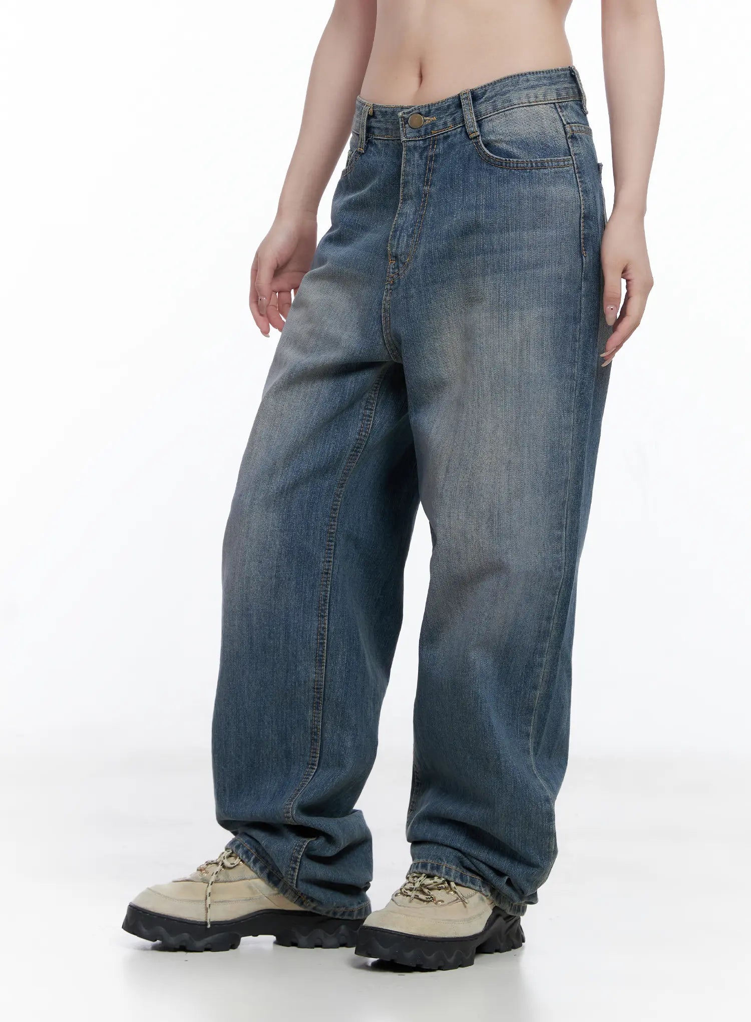 Lala Wide Leg Vintage Washed Jeans CG529 in blue, side view on model, highlighting wide-leg silhouette, long length pooling at ankle, and sun-faded vintage wash cotton denim.