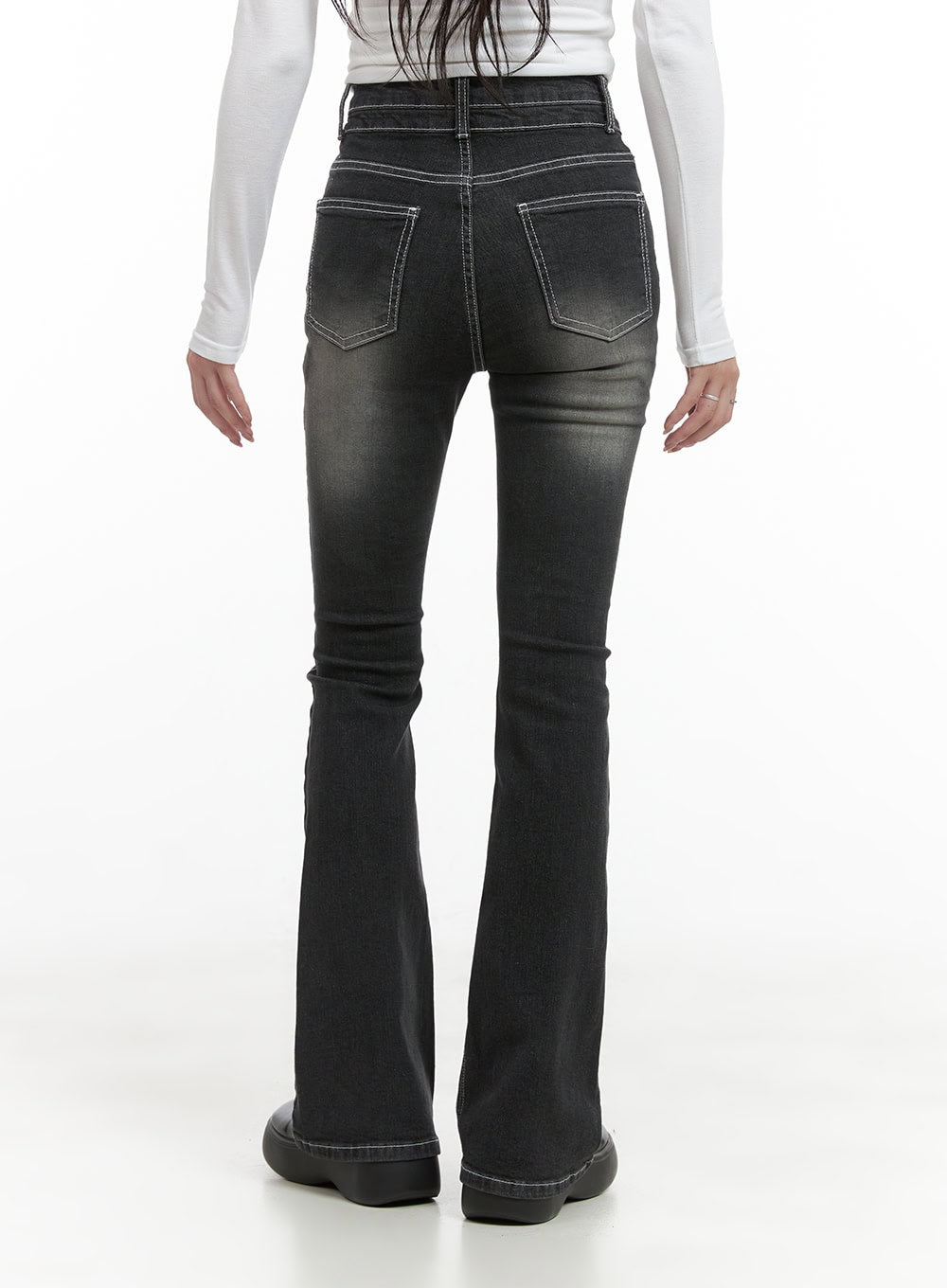 Gigi Two-Button Slim Bootcut Jeans CG421 in black, back view on model, washed denim with white contrast topstitching on rear pockets, slim fit through hips tapering to bootcut flare at hem.