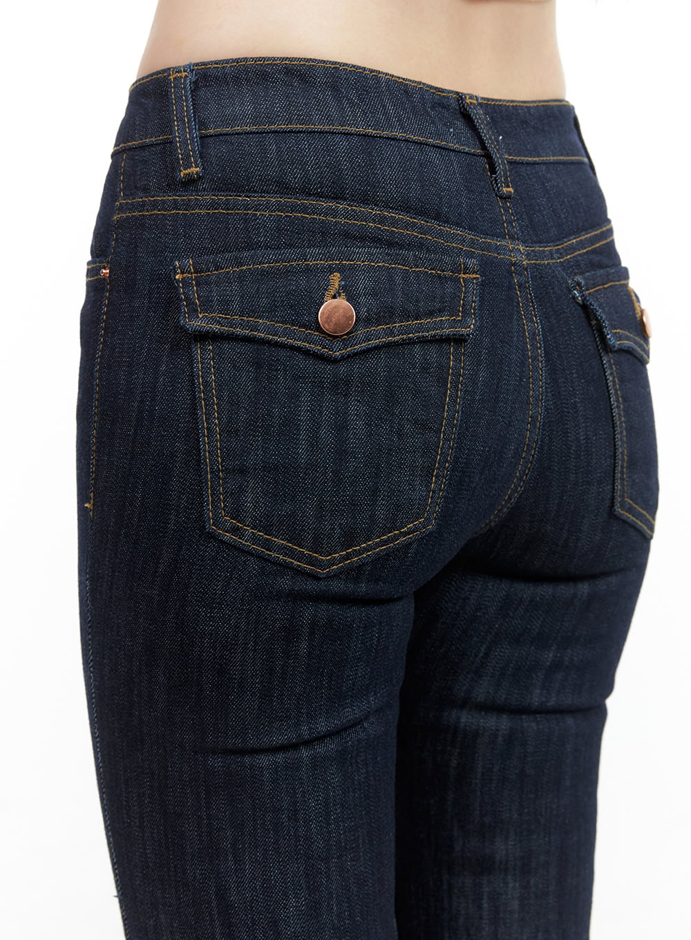 Lila Slim Fit Bootcut Jeans CG409 in dark blue, back close-up detail on model, featuring flap back pockets with copper button hardware and gold contrast stitching on dark denim.