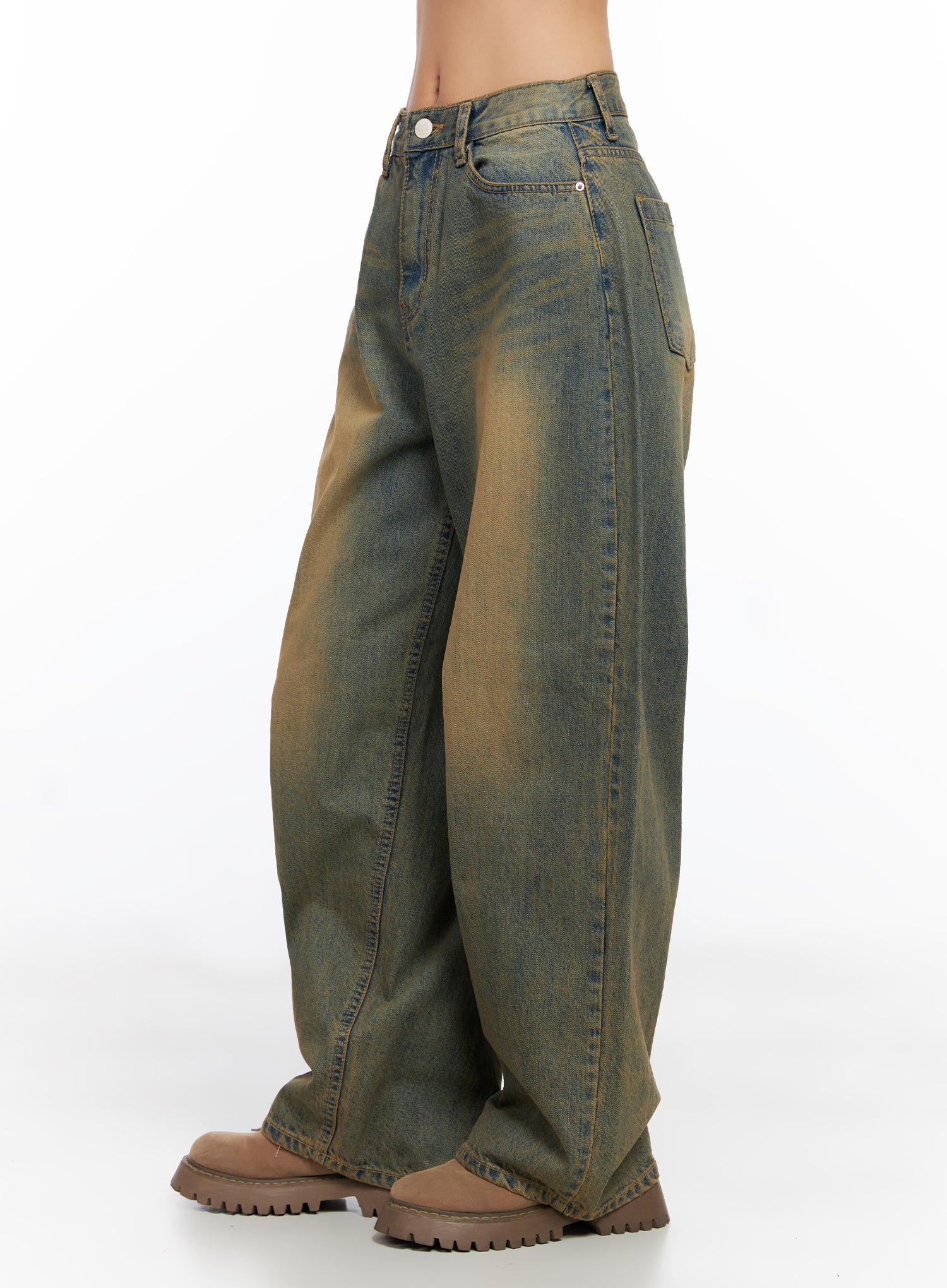 Miley Washed Balloon Baggy Jeans CO515 in vintage green-blue wash, side view on model, showcasing balloon-wide leg silhouette, long inseam, and faded amber wash, paired with chunky brown boots.