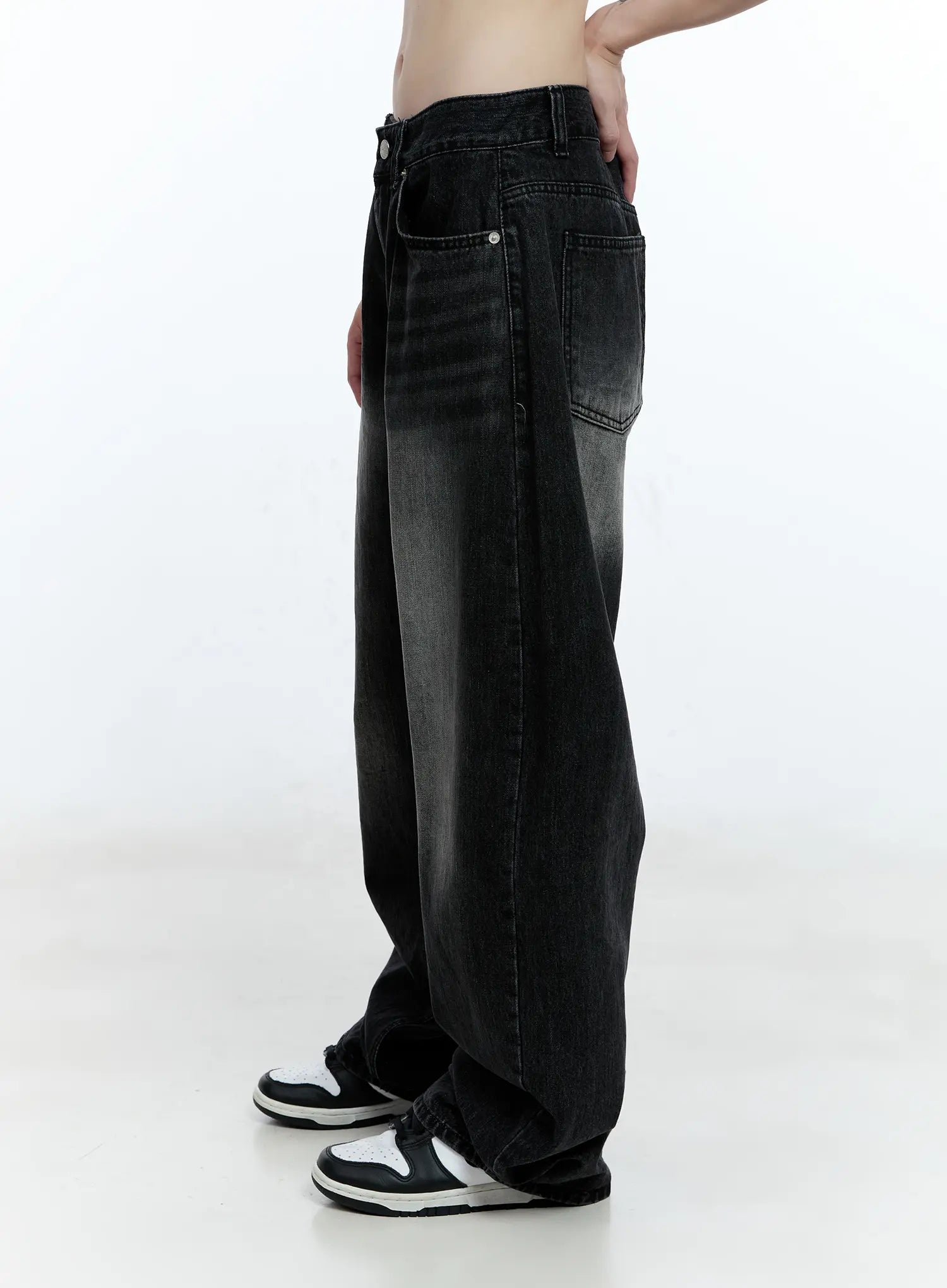 Gayeon Washed Wide-Leg Jeans CG507 in black, side view on model, highlighting ultra-wide leg silhouette, washed fading from dark waist to lighter mid-leg, pooling at sneakers.