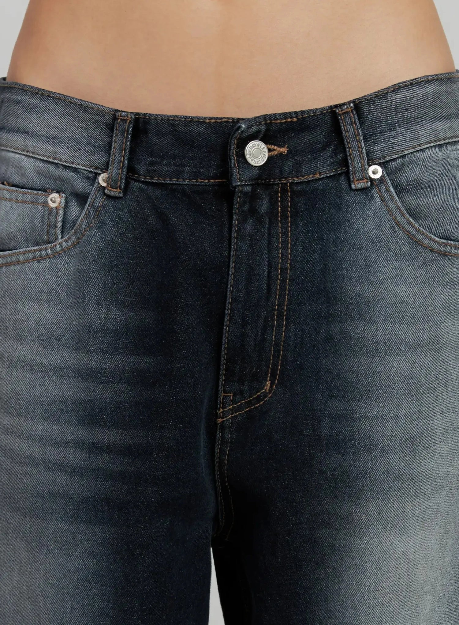 Chaya Washed Wide Jeans IJ505 in dark blue, close-up detail of waistband and front pockets, showing silver button, contrast brown stitching and washed cotton texture.