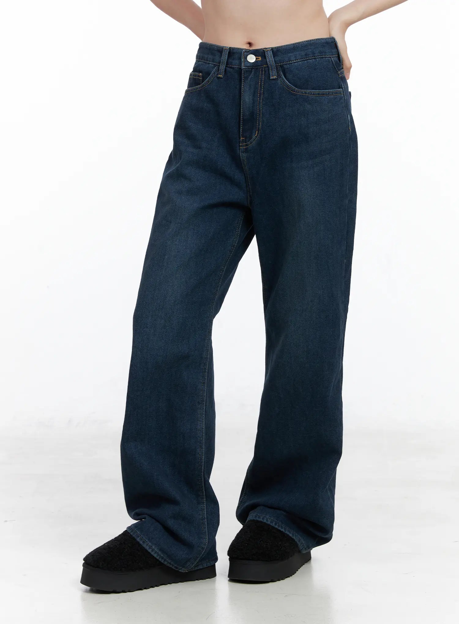 Jordan Velvet Fleece Wide Jeans CN518 in blue, front side view on model, wide-leg long silhouette with washed cotton denim, contrast topstitching visible at waistband and pockets.