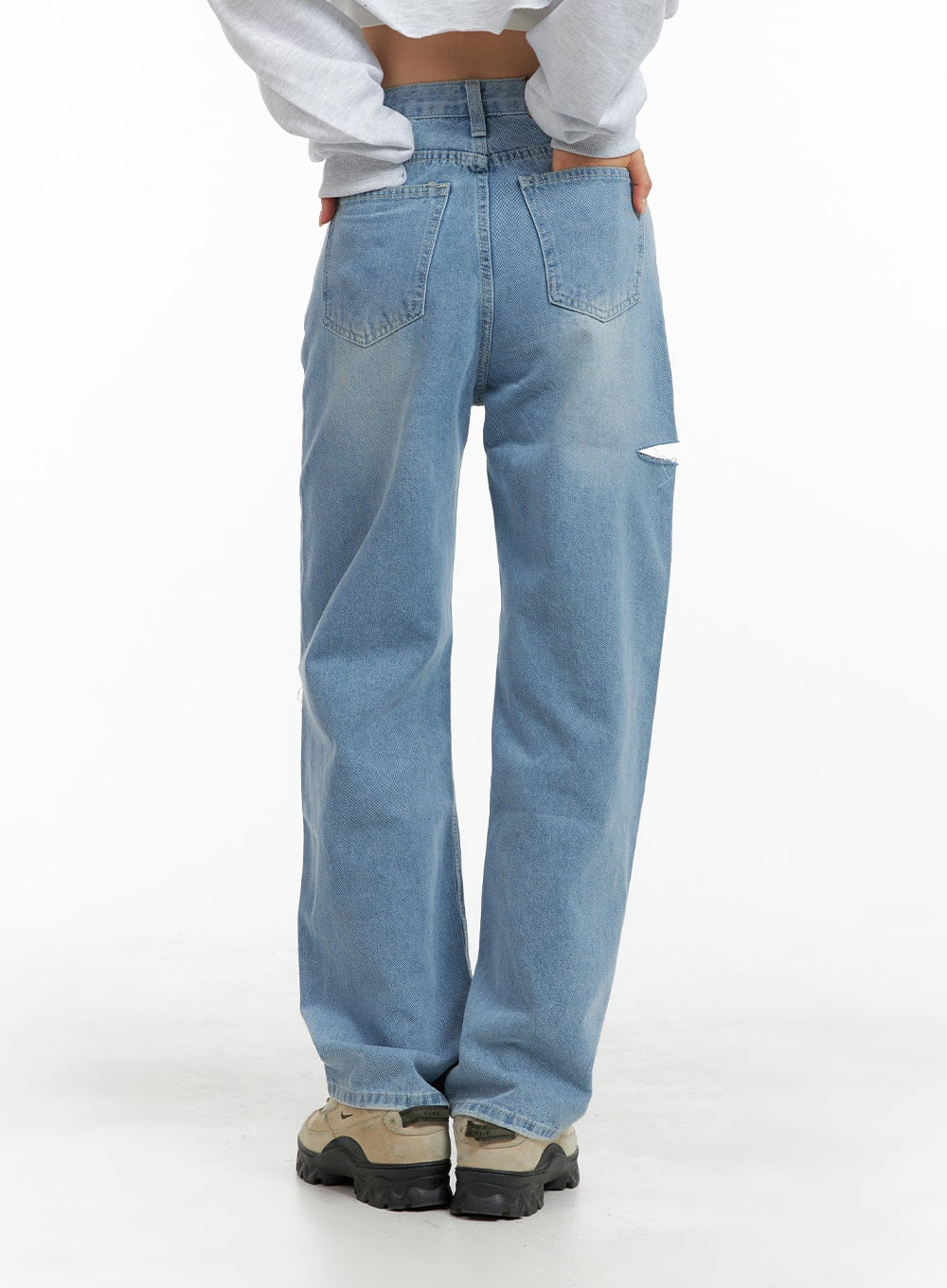 Cut Out Washed Straight Jeans OM421 in blue, full back view on model, dual back pockets with washed fading, side cut-out detail peeking at thigh, straight wide leg silhouette.