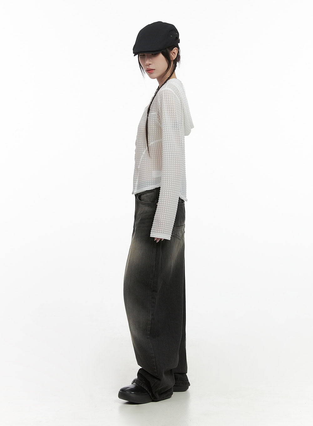 Sage Back-Buttoned Wide Pants CS430 in black, full-body side profile on model in black beret, floor-length wide-leg silhouette with washed fade, styled with white sheer waffle hoodie and black shoes.