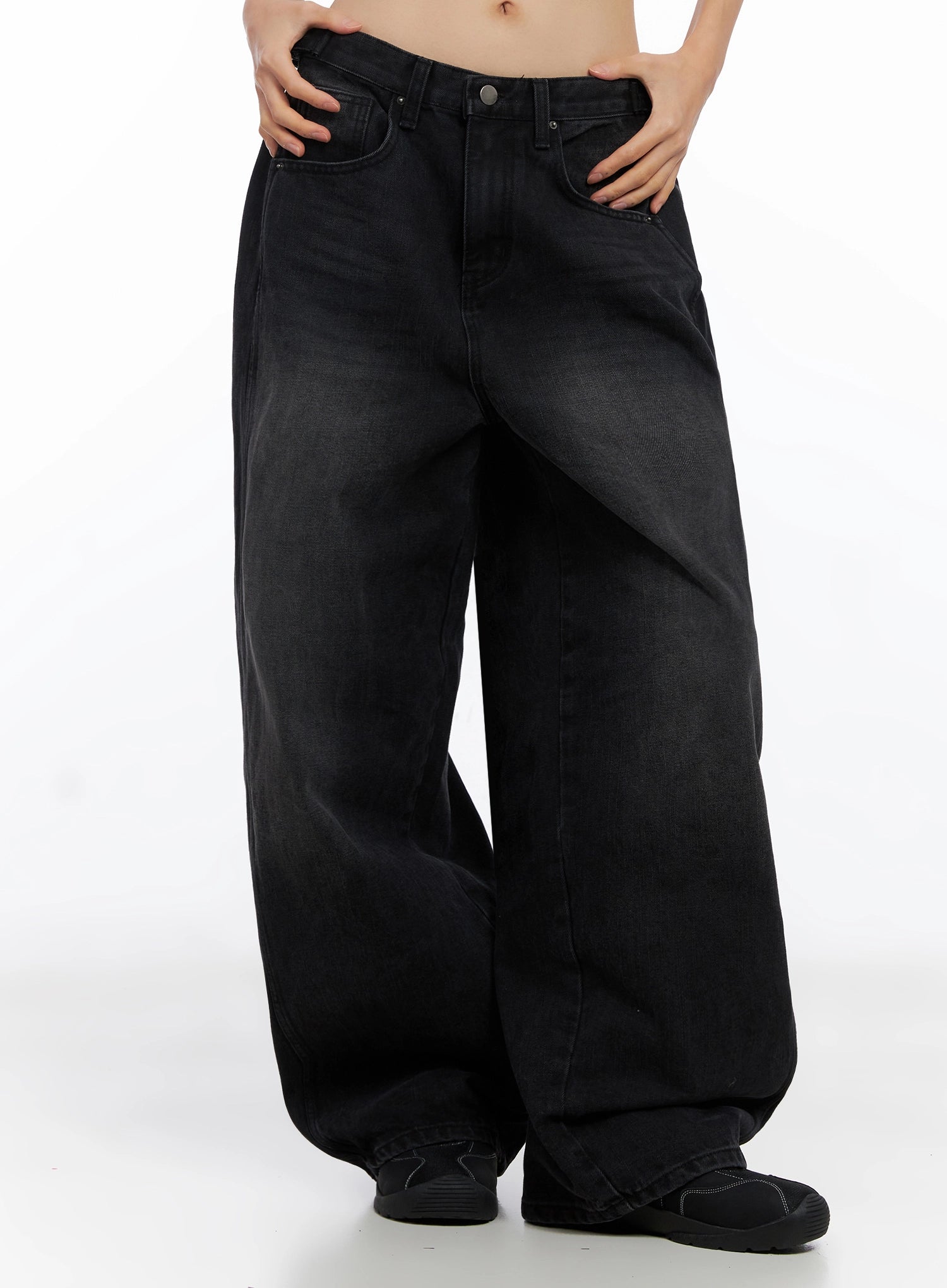 Goffel Side Belt Washed Wide Denim Pants IO517 in black, front lower-body shot on model, hands in pockets, exaggerated wide leg silhouette with washed fade and voluminous drape.