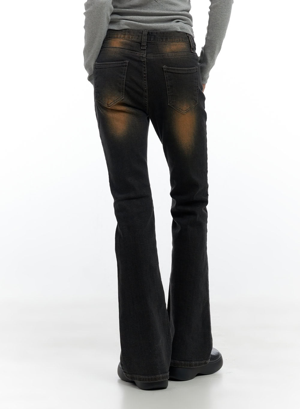 Harley Slim Washed Denim Bootcut Jeans CS420 in Blue, back cropped view on model, dual back pockets with stitched detail, rust-orange washed panels at seat, flared bootcut hem at floor.