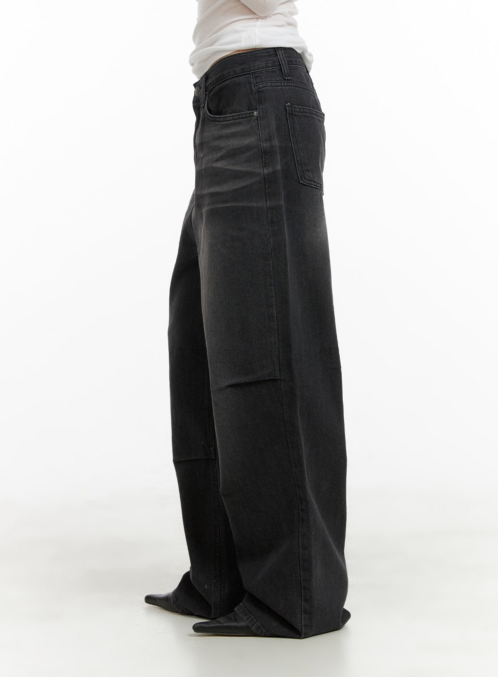 Pintuck Washed Denim Wide Leg Jeans CA419 in black, side view on model, highlighting pintuck seam detail along the leg and wide-fit silhouette, worn with white top.