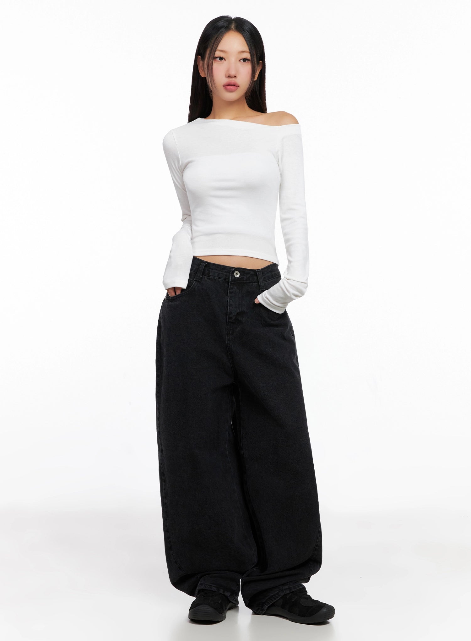 Sunwoo Embroidered Wide Leg Jeans IG528 in black, front full-body on model, loose fit long cotton denim with oversized balloon leg, paired with white off-shoulder crop top and black sneakers.