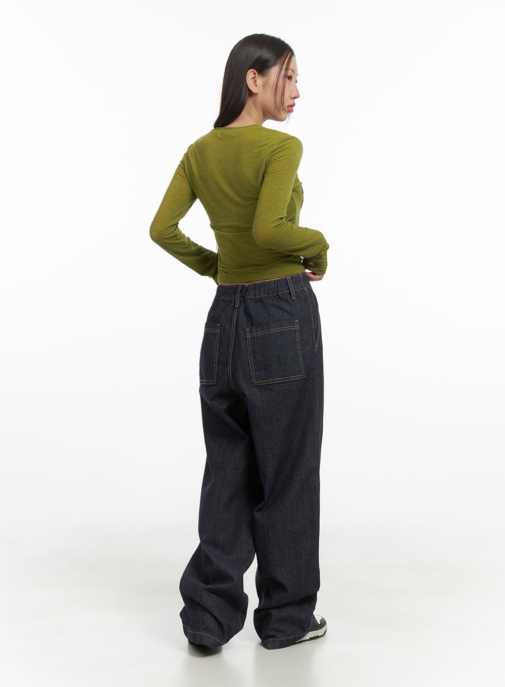 Lola Pintuck Baggy Jeans CO402 in dark blue, back full-length view on model, featuring oversized patch pockets and elasticated waistband detail, paired with olive long sleeve top.