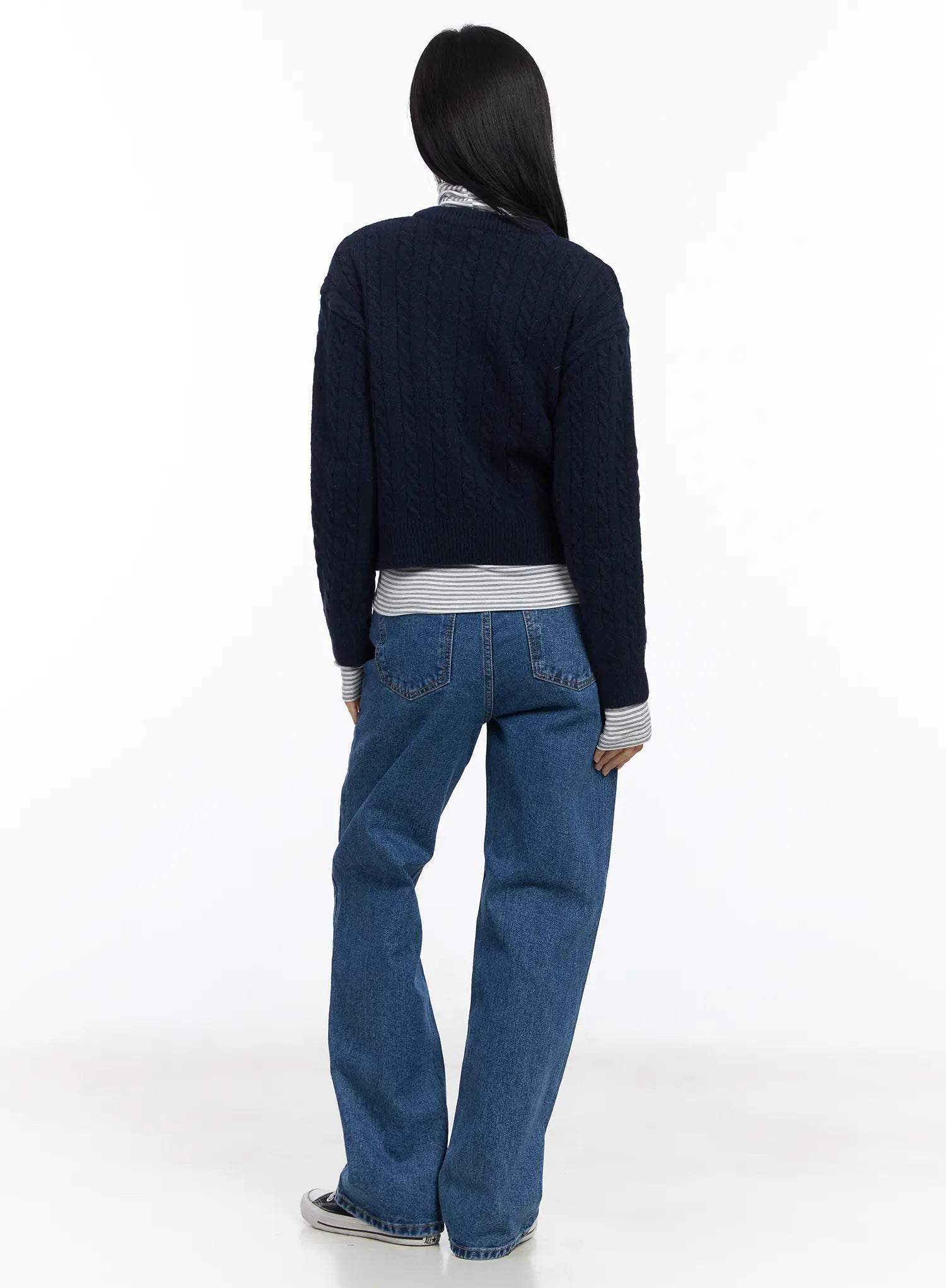 Aila Relaxed Fit Jeans CJ519 in blue, back full-body view on model, wide-leg fit with dual back pockets, paired with navy cable-knit cardigan and striped turtleneck.