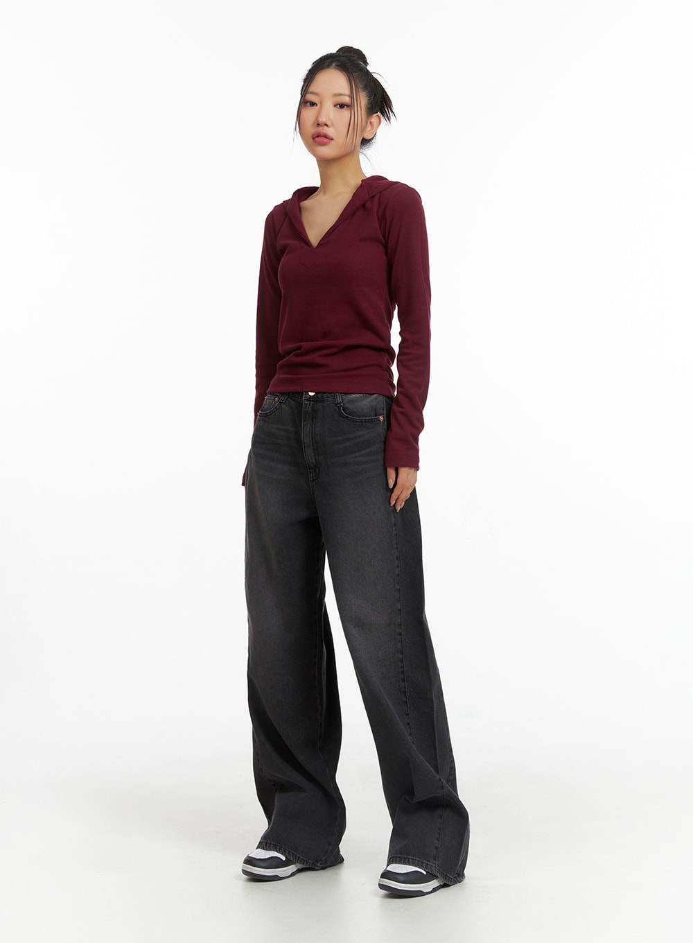 Washed Denim Wide-Leg Jeans CJ426 in black, full-body front shot on model, petite wide-leg washed denim, relaxed street style, paired with burgundy v-neck hooded top and sneakers.