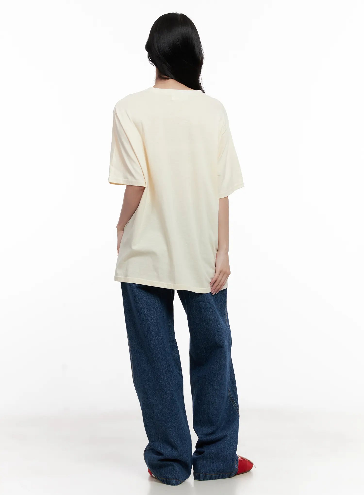 Ahyeon Classic Relaxed-Fit Denim Jeans CL515 in dark blue, back view on model, wide-leg cotton denim with relaxed fit, styled with cream tee and red flats.