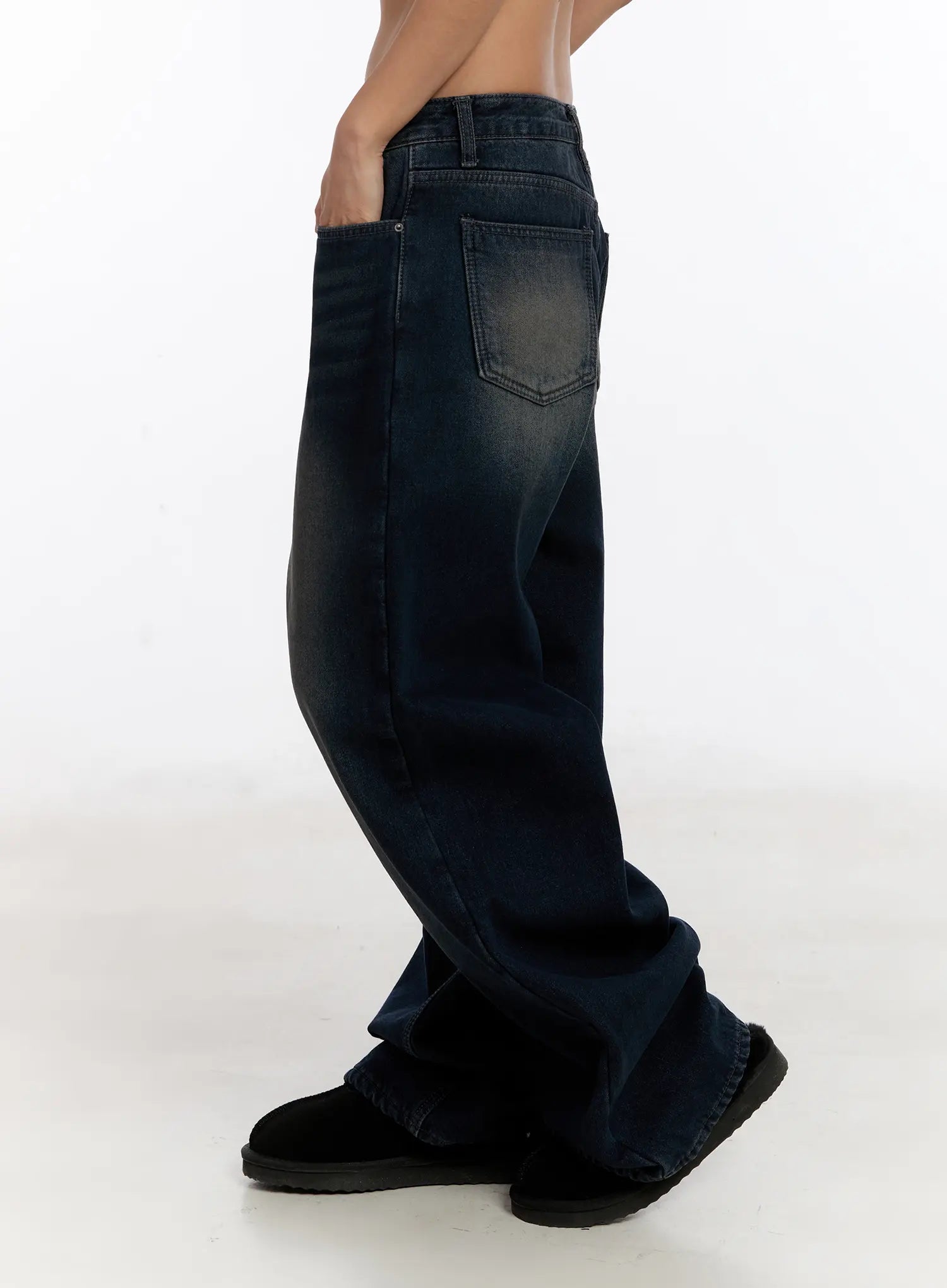 Auro Fleece-lined Wide Leg Jeans CN527 in dark blue, side view on model, back pocket and wide-leg silhouette visible, washed cotton denim with faded gradient, styled with black shearling boots.