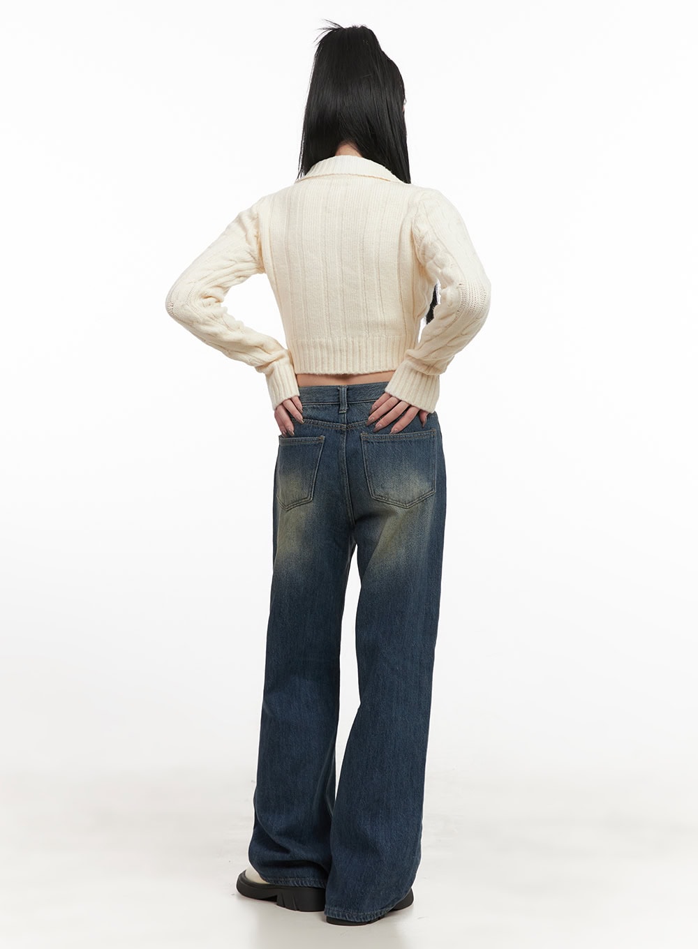 Audrey Washed Wide-Leg Jeans CJ516 in dark blue, back full-body view on model, showing back pockets and washed fading on wide-leg cotton denim, styled with cream cable-knit crop top.