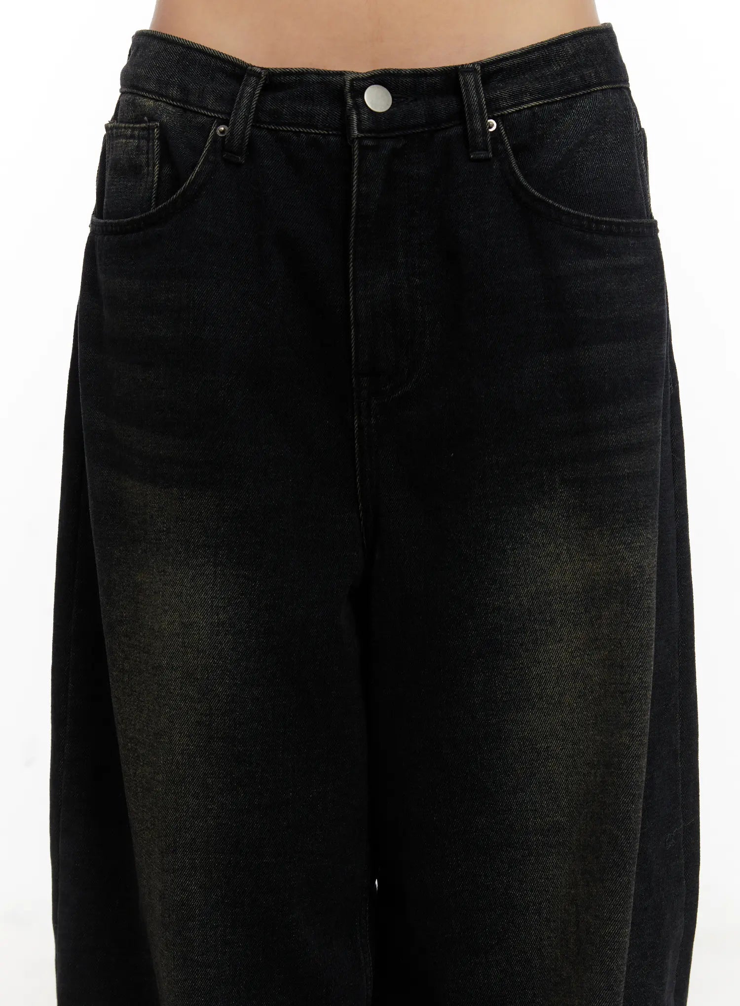 Myla Dark Wash Wide-Leg Jeans CD512 in dark black wash, close-up detail of waistband and front pockets on model, showing button fly, rivets, and dark washed cotton denim texture.