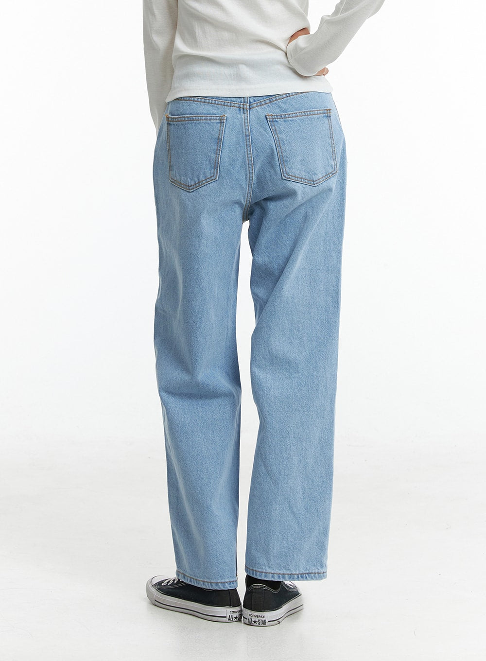 Light Washed Straight Jeans ON329 in light blue, back view on model, two back patch pockets with contrast stitching, relaxed straight-fit washed cotton denim.