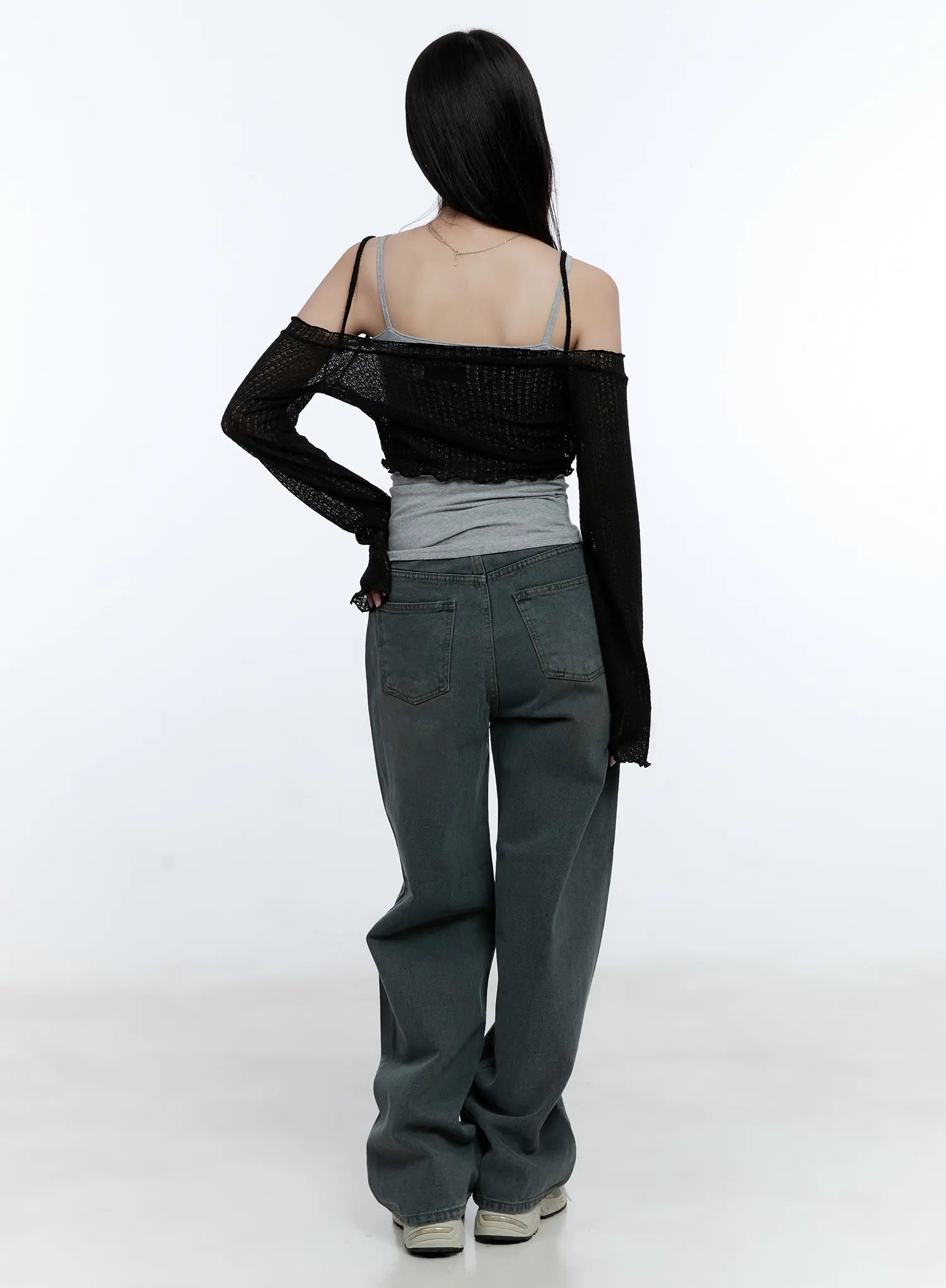 Herri Relaxed Semi-Wide Jeans CG512 in dark blue, back full-body shot on model, washed denim showing rear patch pockets and wide-leg hem, styled with black open-knit cardigan.