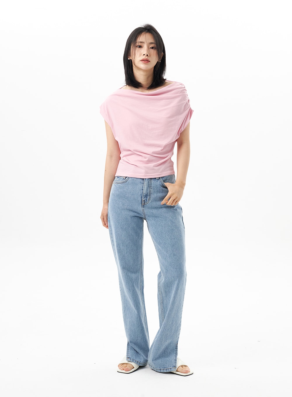 Slit Detail Jeans OU314 in blue, full-length front shot on model standing straight, straight-fit high-waist cotton denim, styled with pink draped top and white sandals.