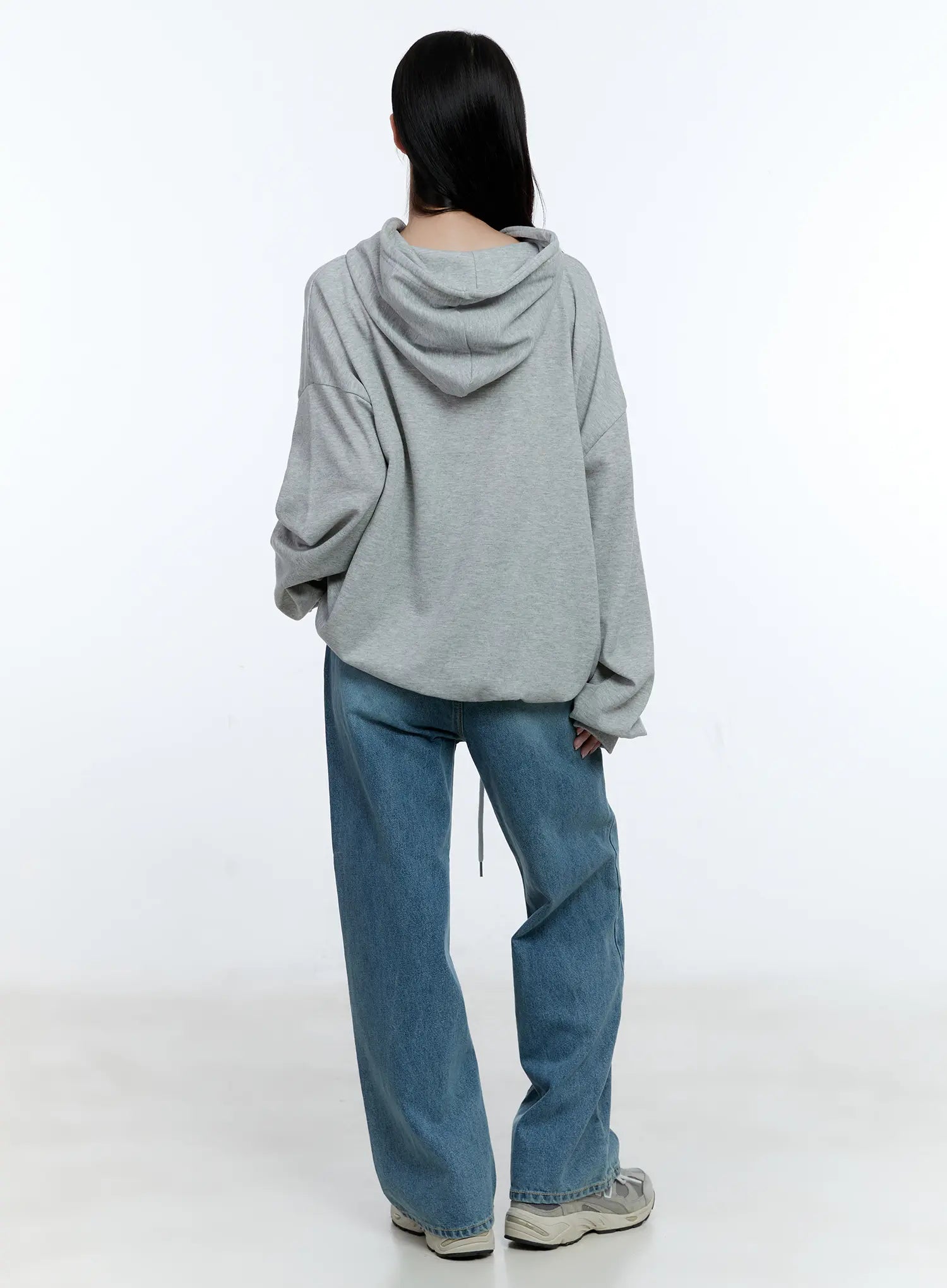 High-Waist Wide-Leg Drawstring Jeans CG513 in blue, back full-body shot on model, washed wide-leg denim showing back pockets and relaxed fit, styled with oversized grey hoodie.