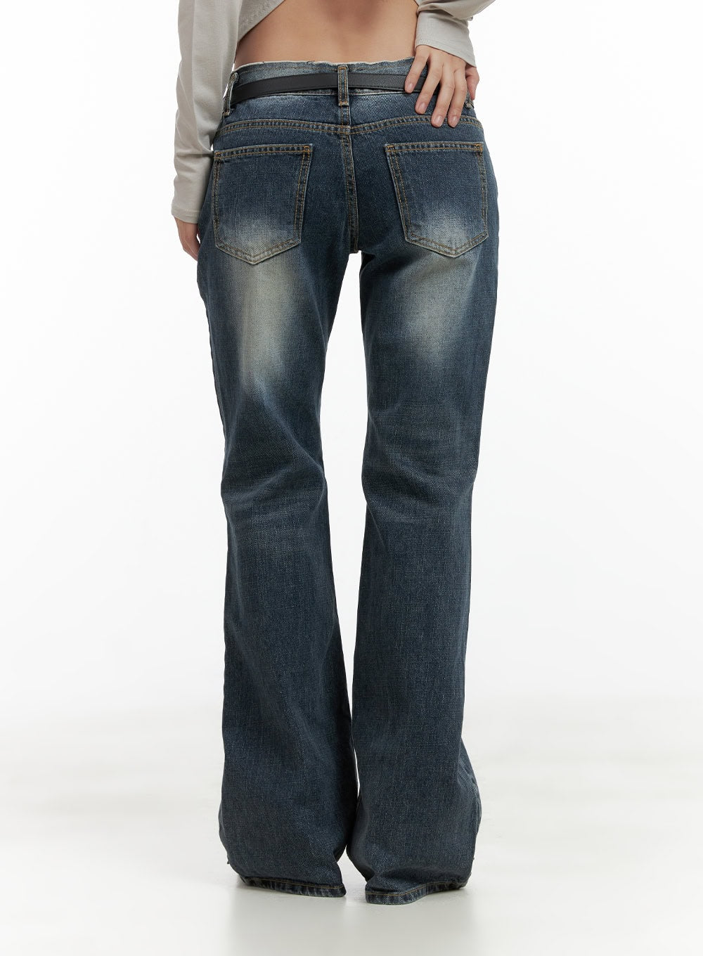 Low Rise Front Seam Bootcut Jeans CL417 in dark blue, back view waist-down on model, dual back pockets with contrast topstitching, low waist and bootcut hem in washed cotton denim.
