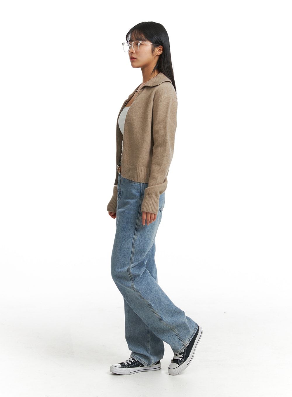 Washed Straight Wide Denim OJ405 in blue, side-view full-body on model, straight wide silhouette showing leg line and length, paired with beige knit cardigan and sneakers.
