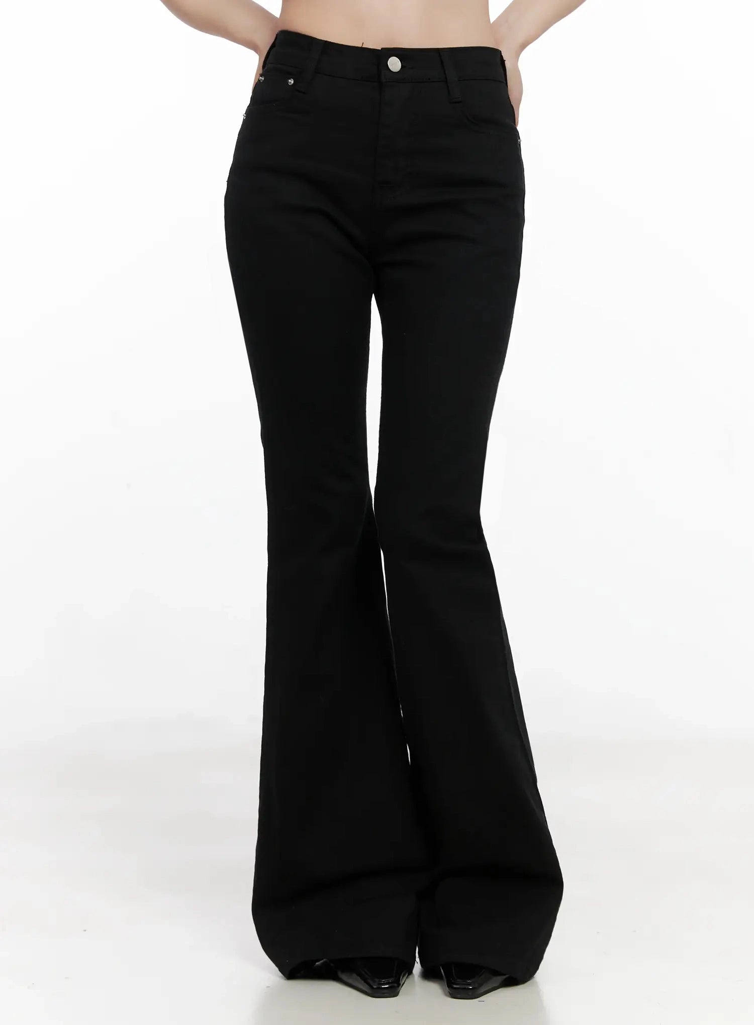 Dream Chic Black Flare Jeans IN514 in black, front mid-body shot on model, high-waist fit with silver button closure, smooth cotton-spandex fabric, dramatic flare hem.