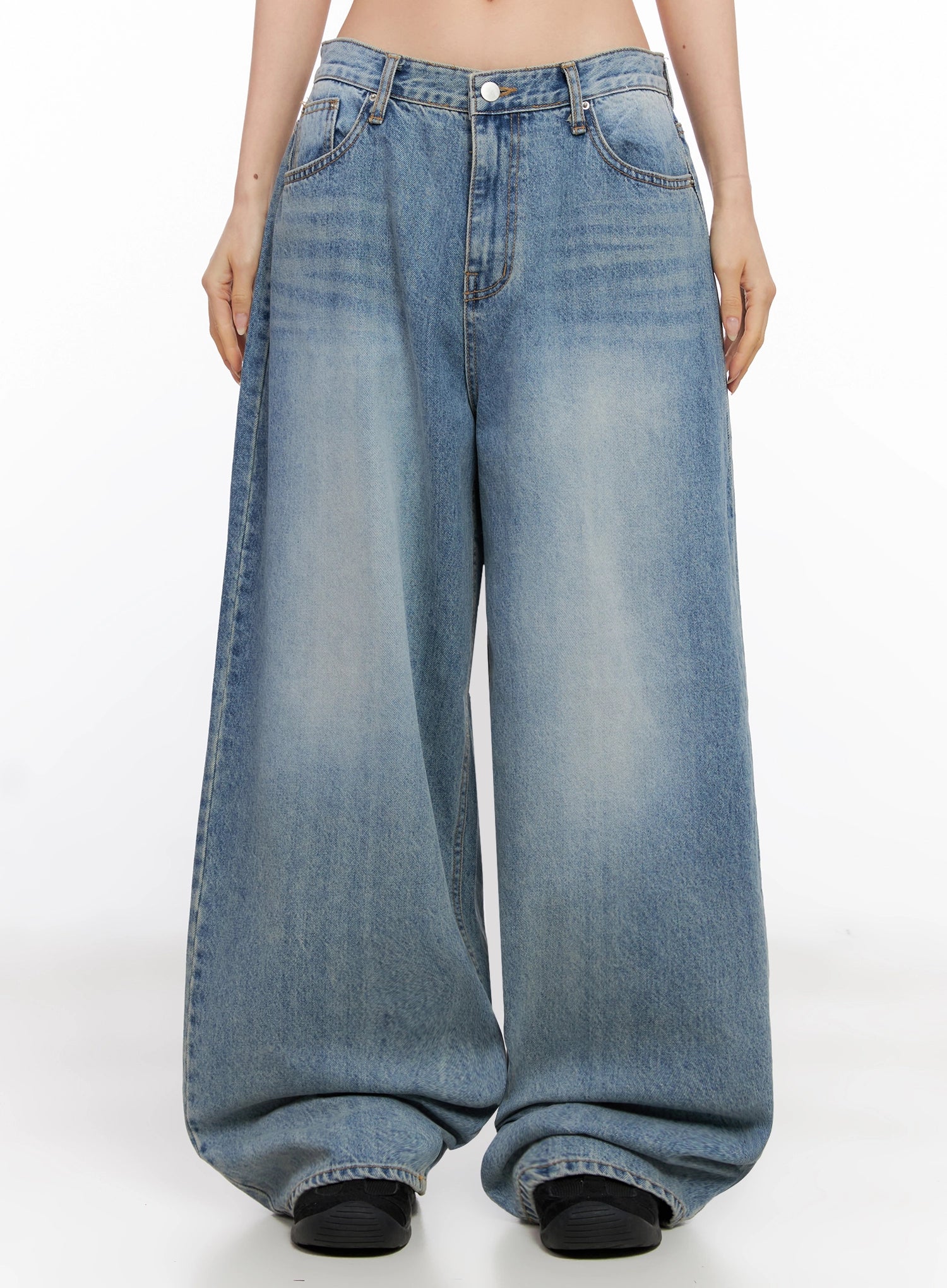 Seojin Washed Wide-Leg Jeans IG508 in blue, front full-length on model, arms at sides, showing oversized wide-leg silhouette with pooling hem and washed fade.