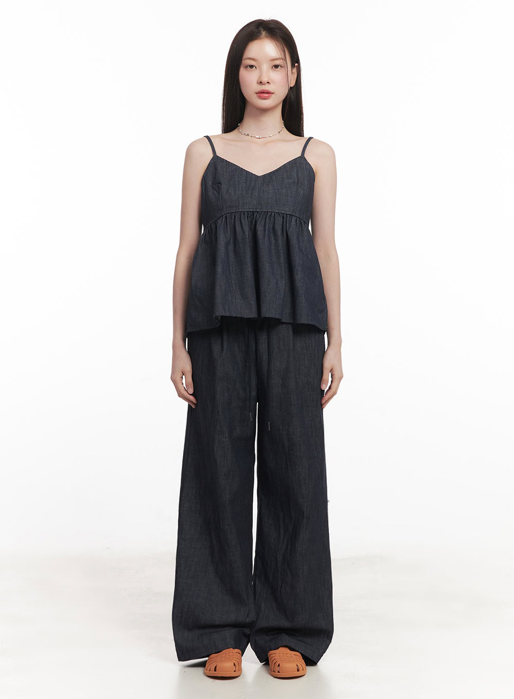 Cotton Denim Wide-Leg Pants IY509 in dark navy, front full-length shot on model standing straight, wide-leg silhouette with elastic banded waist, paired with denim spaghetti-strap top and orange sandals.