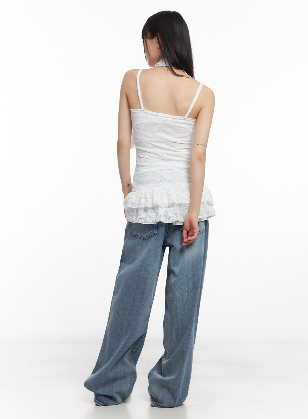 Pauline Wide-Leg Baggy Jeans CY512 in blue, back full-length shot on model, rear pockets detail, wide washed denim leg, styled with white lace cami and black belt.