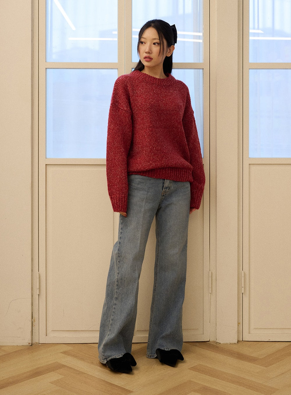 Casual Denim Solid Straight Leg Jeans OD326 in blue, full-length front view on model standing by window, high-rise washed denim wide leg, relaxed casual look with red chunky knit sweater.