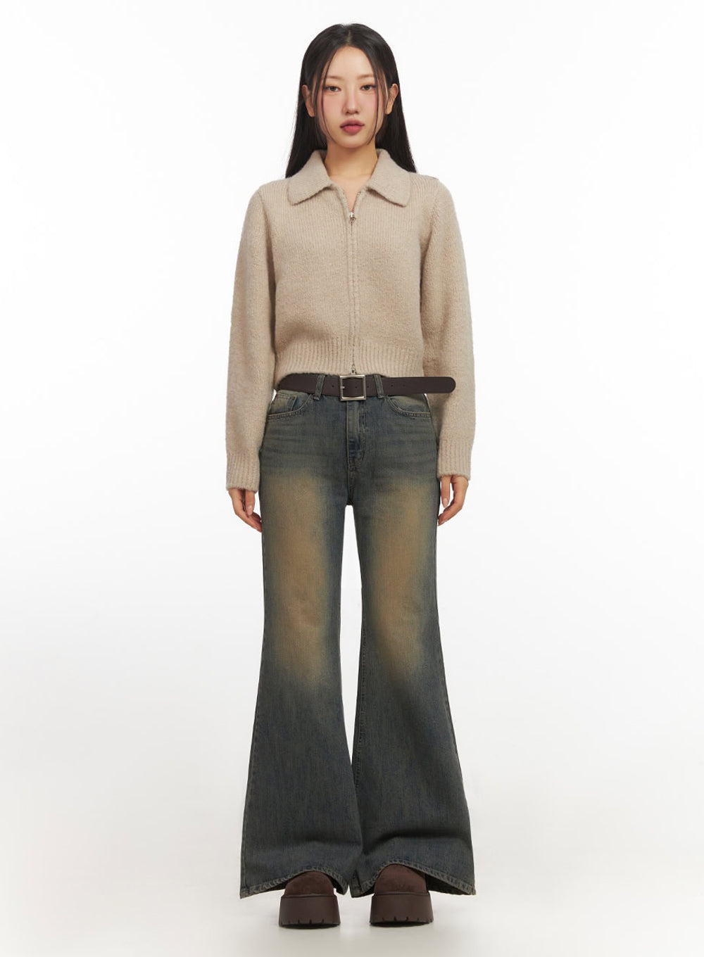 Kourtney Vintage Wash Flared Jeans IF510 in dark blue, full-length front standing shot on model, slim-fit flared denim with golden-brown vintage wash, paired with beige zip collar knit and brown belt.