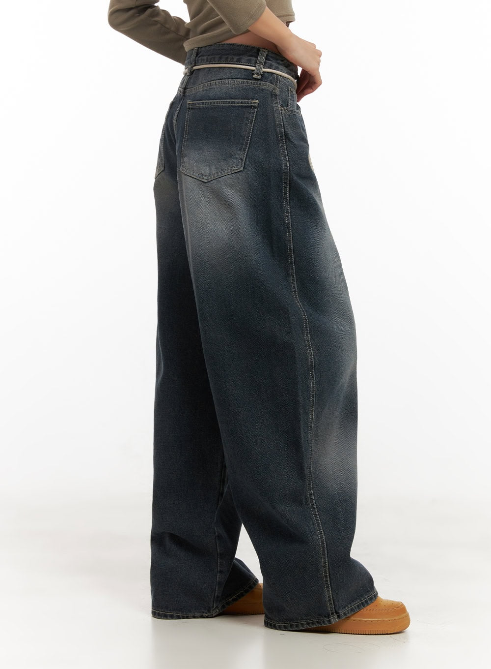 Vivian Washed Cotton Baggy Jeans CD409 in dark blue, side-back view on model, showing voluminous wide leg, back pocket, washed fade, and cream string at waistband.