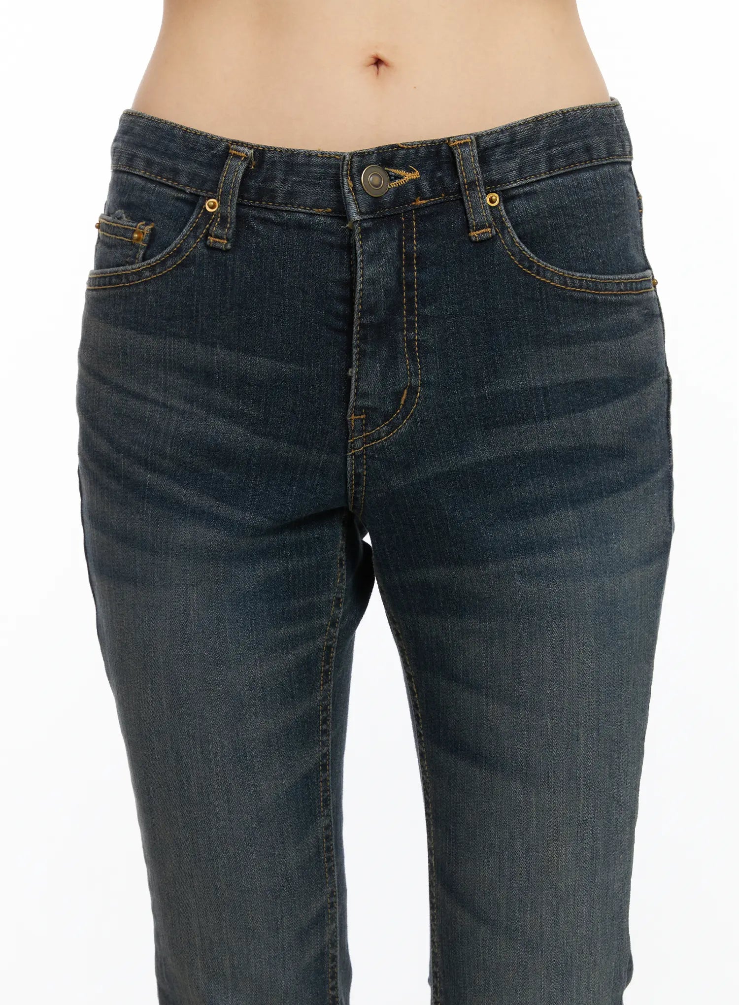 Kai Vintage Washed Flare Jeans CD515 in dark indigo, close-up of front waistband and pockets, showing antique brass button, gold topstitch detailing, and washed cotton fabric texture.